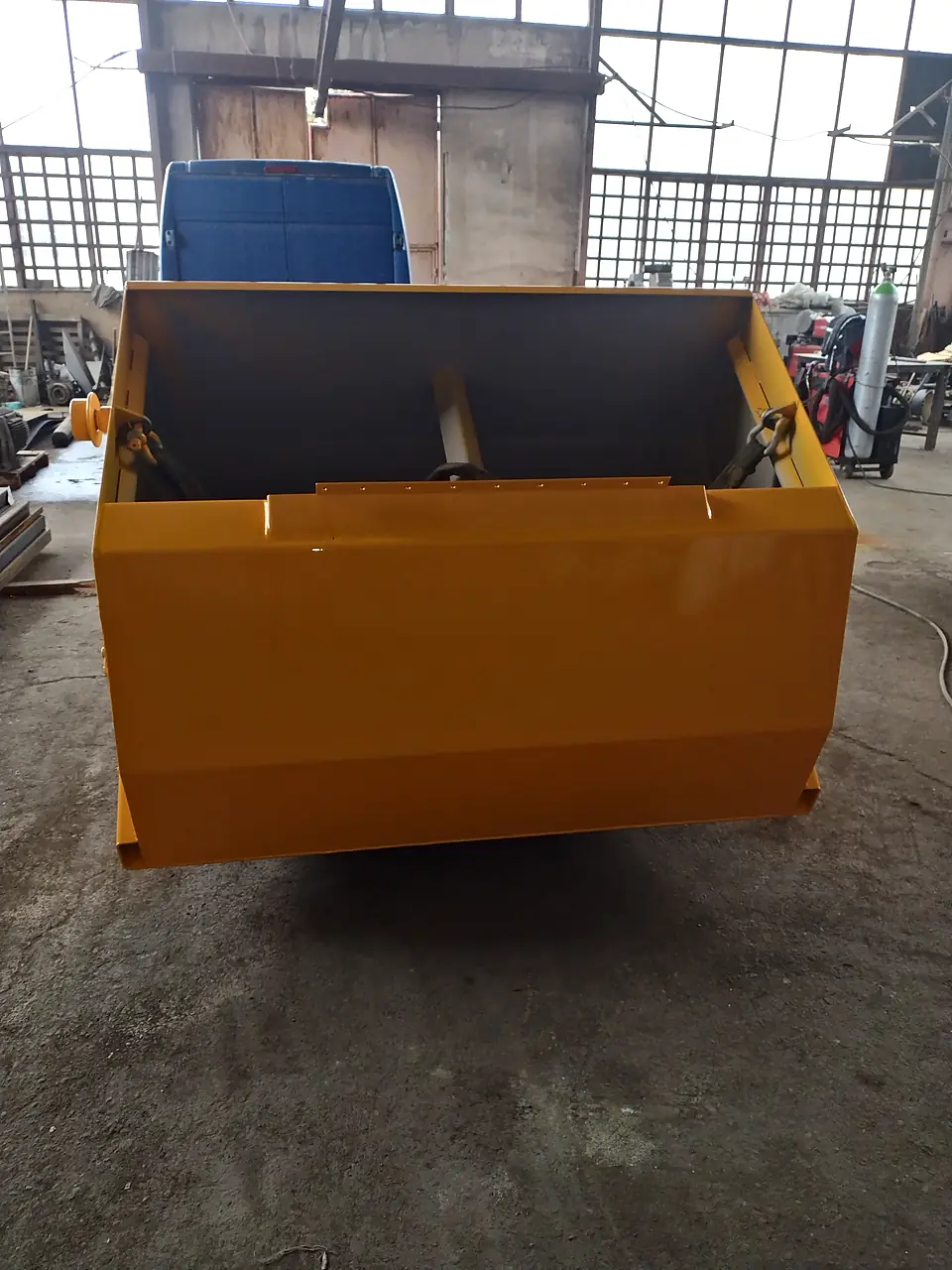 Freshly painted steel hopper in the workshop