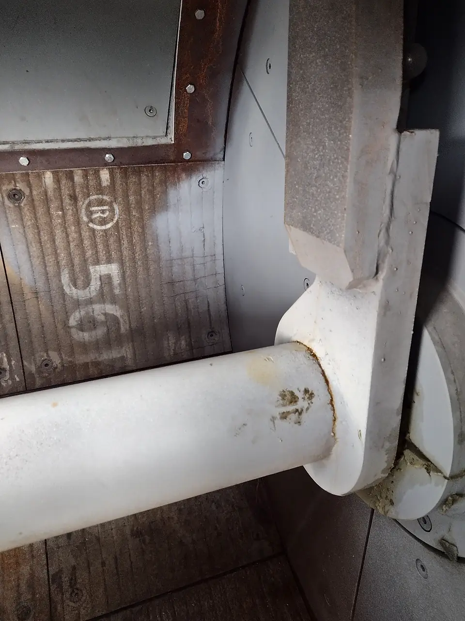 Mixer shaft and arm in front of numbered wear liner plates